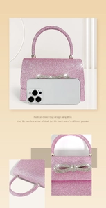 Pink sequin evening bag with rhinestone bow detail shown beside a phone for scale