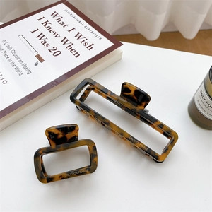 Set of two tortoise shell acetate hair claws with hollow square design and France lettering