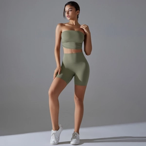 Detailed texture of olive green yoga set featuring a ruched bandeau top and high waist shorts