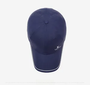 Detail of dark blue breathable mesh baseball cap featuring white Legend logo embroidery
