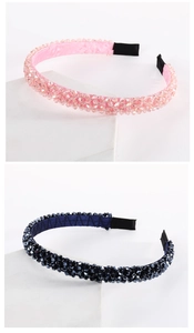 Detailed view of handmade beaded headbands with pink and navy faceted crystals on satin padding