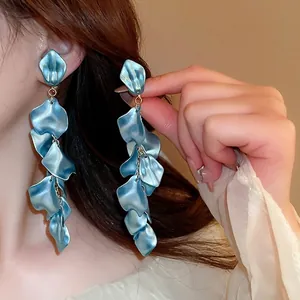 Elegant blue rose petal tassel clip-on earrings with pearlescent finish and gold chains