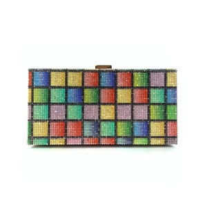 Macro detail of rainbow crystal checkered evening clutch bag with gold metal clasp