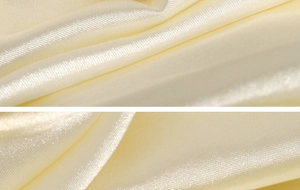Detail of yellow satin fabric with high gloss and smooth texture for luxury ring display