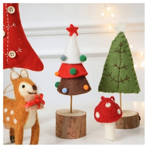 Detailed view of handmade wool felt Christmas trees, reindeer, and mushroom ornaments