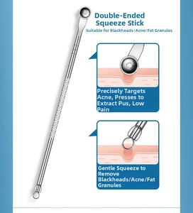 Detailed macro view of a dual-ended stainless steel blackhead remover with anti-slip handle