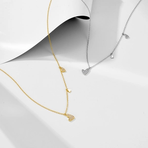 Minimalist heart pendant necklaces in gold and silver finish with fine sparkling crystals