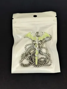 Luminous dragon wrapping around a sword pendant with glowing green enamel details