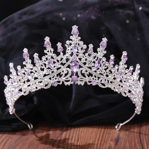 Detail shot of luxurious silver tiara with purple crystals and sparkling rhinestones