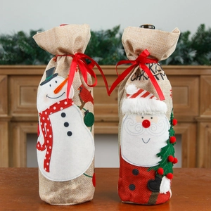 Christmas burlap wine bottle covers with Santa and Snowman embroidery and red ribbons