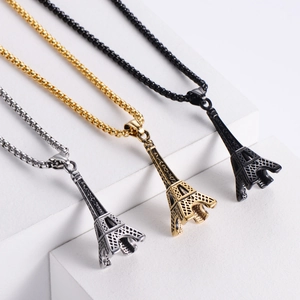 Vintage Eiffel Tower pendant necklaces in silver, gold, and black stainless steel