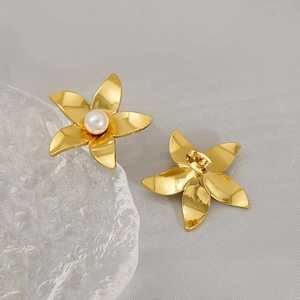 Minimalist gold flower stud earrings with white pearl center and butterfly clasp