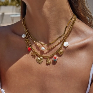 Layered 18K gold stainless steel necklace with red heart and strawberry charms