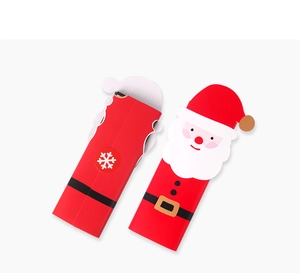 Detail of Santa Claus paper gift boxes with snowflake patterns for Christmas candy packaging