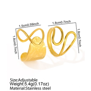 Detail of adjustable golden stainless steel rings set with textured hammered surface