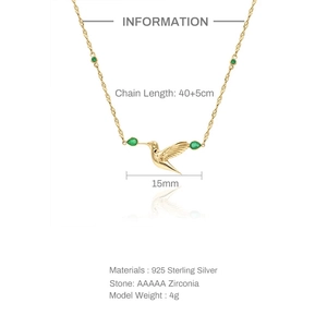Detailed spec view of a gold-plated S925 silver hummingbird pendant with green zircons