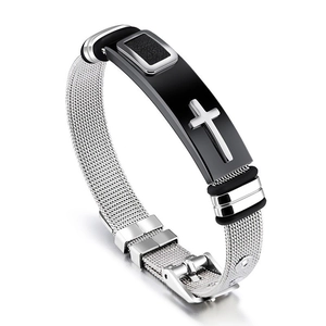Close-up of silver mesh bracelet with black cross charm and rubber accents