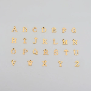 Collection of golden stainless steel alphabet pendants featuring special accented characters