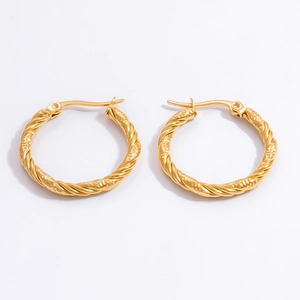 Close-up of golden twist rope hoop earrings in 18k gold plated stainless steel