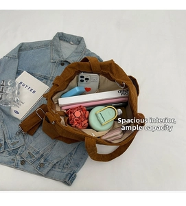 Interior view of brown corduroy tote bag showing large storage capacity for daily items