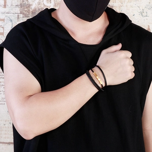 Men's multilayer black braided leather bracelet with a minimalist gold metal bar accent
