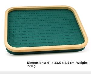 Bamboo jewelry tray with dark green velvet slots for rings and earrings display
