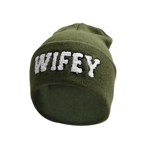 Close-up of WIFEY embroidery on military green knitted beanie for winter warmth