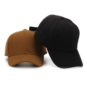 Classic textured baseball cap in black and tan colors with adjustable back strap
