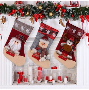 Detailed view of large Christmas stockings with Santa, Snowman and Reindeer characters