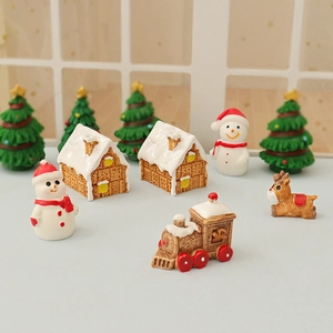 Miniature Christmas resin figurines set with snowmen, gingerbread houses and trees