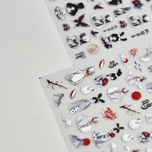 Macro detail of Japanese-style ink painting nail stickers featuring fox scholar and crane