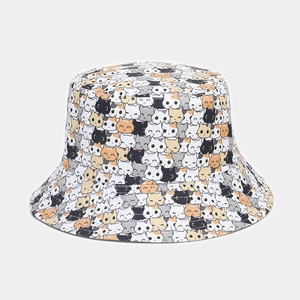 Detailed close-up of colorful cartoon cat prints on a high-quality cotton bucket hat