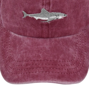Detailed view of the shark embroidery on vintage washed burgundy baseball cap