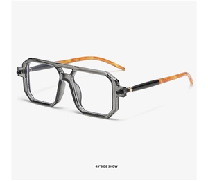 Detail view of double bridge square sunglasses with translucent grey frame and amber temples