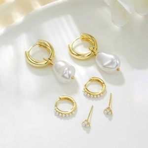 Three-pair set of gold plated earrings featuring baroque pearls and sparkling zircon accents