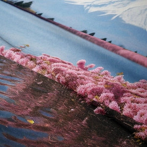 Detailed close-up of soft velvet fabric texture and Mount Fuji landscape print