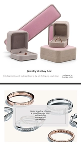 Detailed view of gray and pink velvet jewelry boxes for necklaces, rings and bracelets