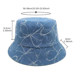 Washed denim bucket hat with clover pattern and size chart for sun protection