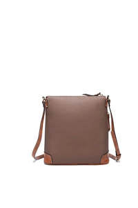 Detailed close-up of dark brown pebble leather texture and stitching on the crossbody bag