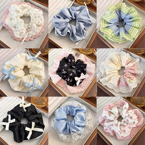 Variety of lace and satin scrunchies with plaid patterns and decorative bows in 9 styles