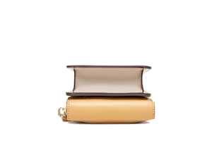 Detail showing the layered texture, hardware zip, and stitching of the PU leather phone bag