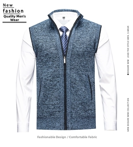Detail of navy blue marl knit vest featuring stand collar, full zip and side pockets