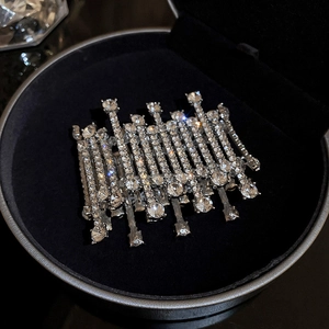 Macro shot of silver-colored multi-row crystal cuff bracelet in a black velvet jewelry box