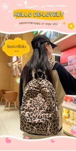 Detail of leopard print backpack with corduroy texture and sturdy black shoulder straps