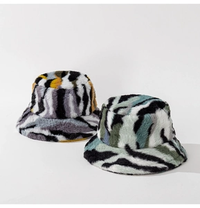 Detailed plush winter bucket hats in grey zebra and blue marble camouflage patterns