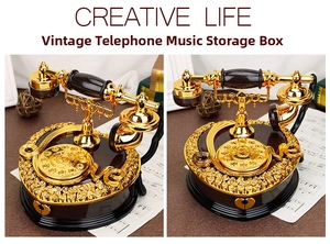 Detailed macro view of vintage rotary phone music box with golden finish and heart base