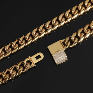 Close-up of 12mm gold Cuban link chain with a micro-pave diamond square clasp detail
