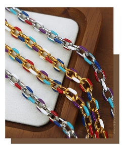 Macro detail of multi-color enamel rectangular link chain with gold and silver plating