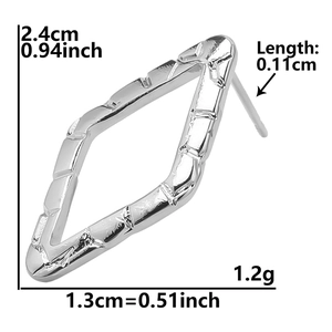 Detail view of silver geometric diamond earrings with dimensions 2.4cm by 1.3cm