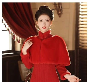 Close-up detail of luxury red faux fur shawl and elegant matching knit dress for winter